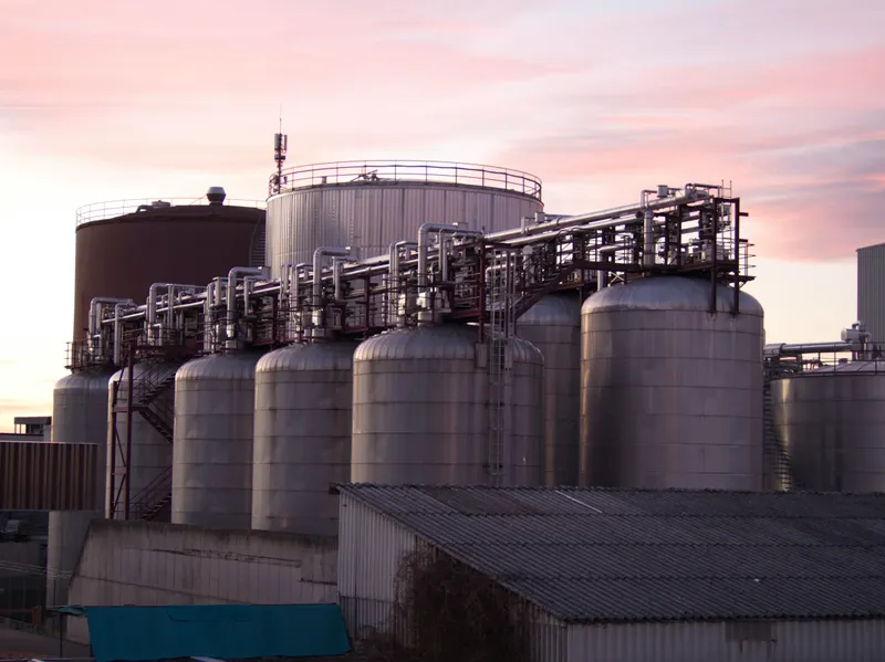Bulk petroleum storage tanks at dusk