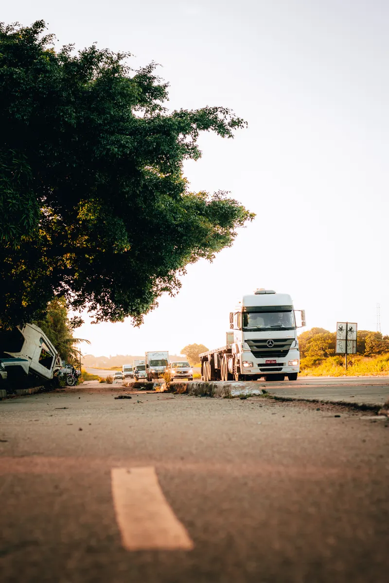 Freight trucks on a highway at dusk