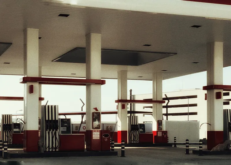 A service station forecourt under its canopy